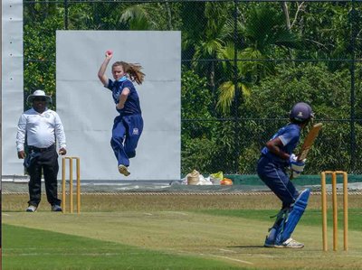 Gloucestershire seamer Maddie Hughes bowls during a game against Wadduwa Central College