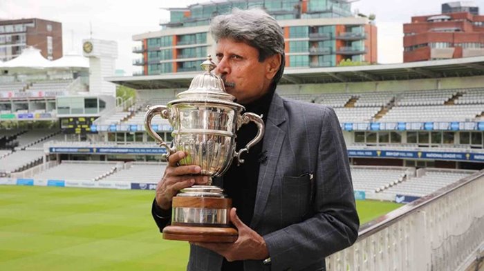 Kapil Dev, in 2019, with the original 1983 Prudential Trophy