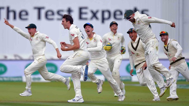 Australia celebrate a wicket at Lord's.