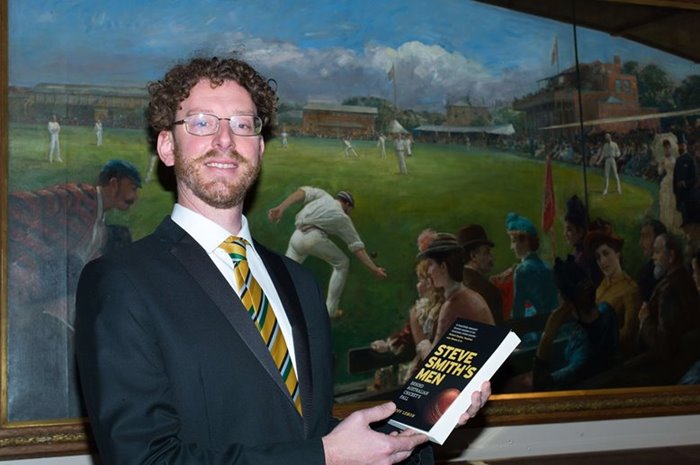 Geoff Lemon poses with his book.