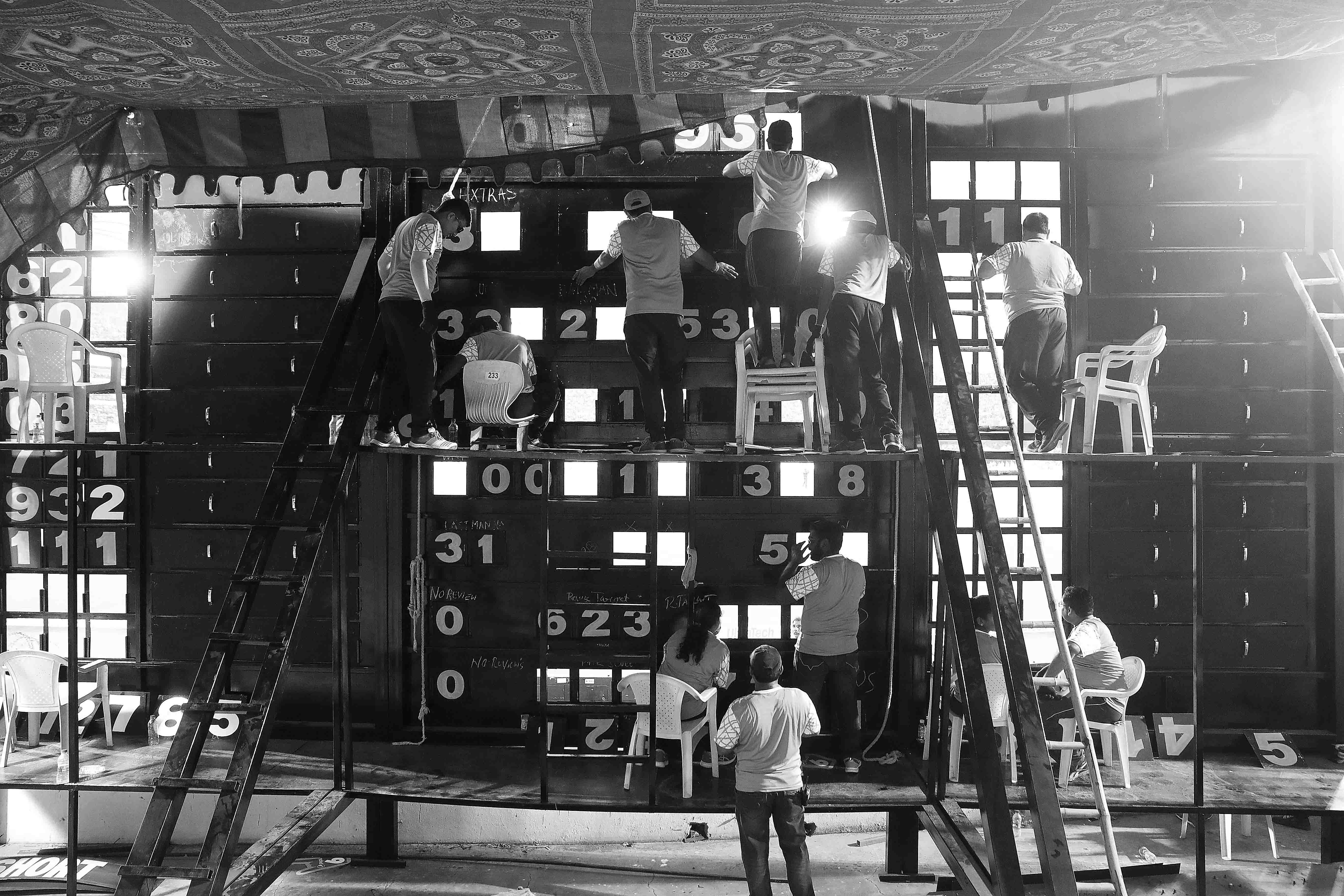 A general view of the scoreboard operators during the one-day international between India and Australia at Rajiv Gandhi International Cricket Stadium.