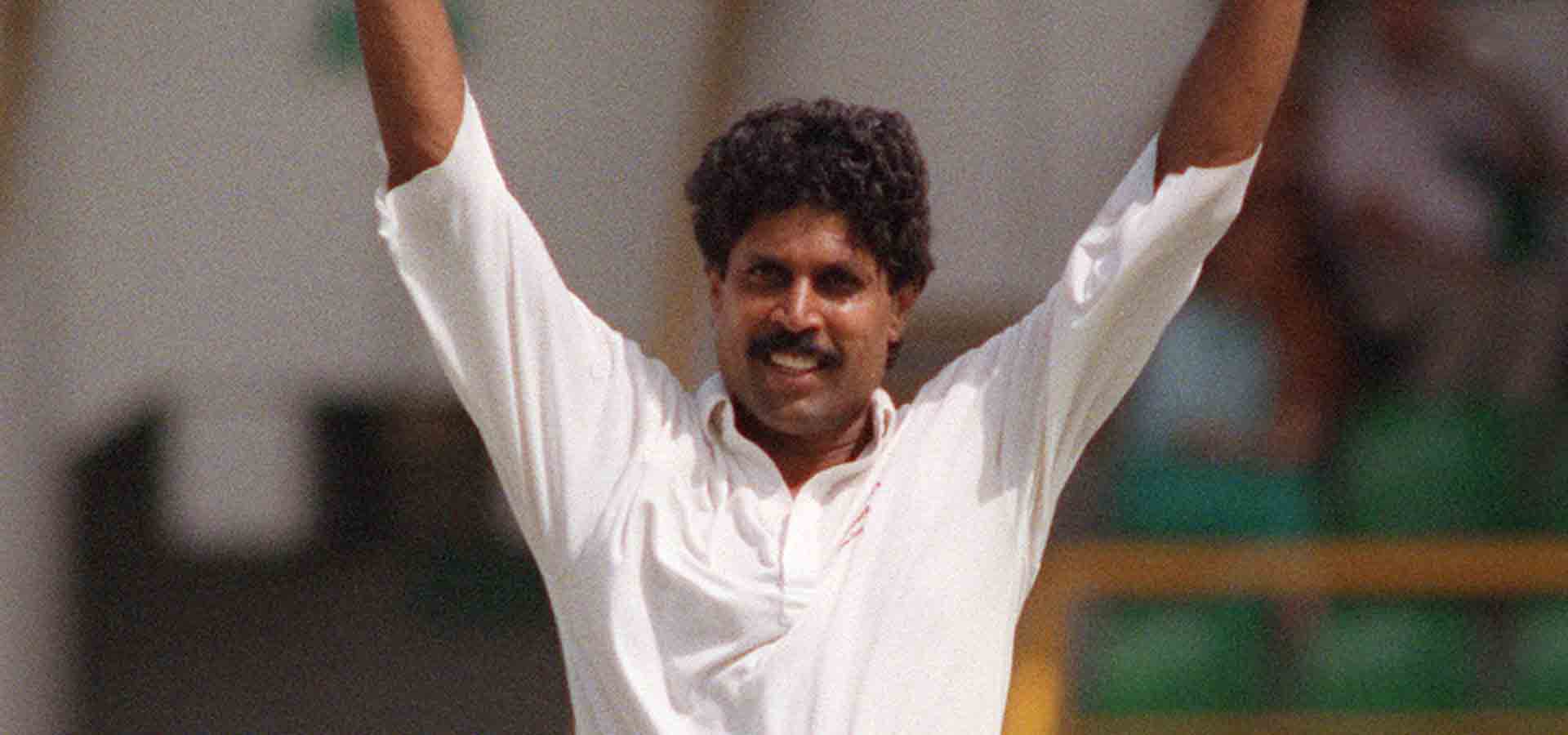 Kapil Dev celebrating a wicket.