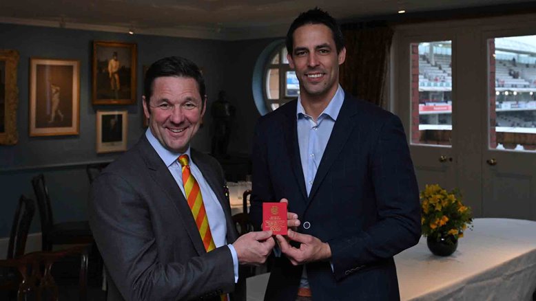 MCC Chief Executive Guy Lavender presents Mitchell Johnson with his MCC Honorary Life Membership